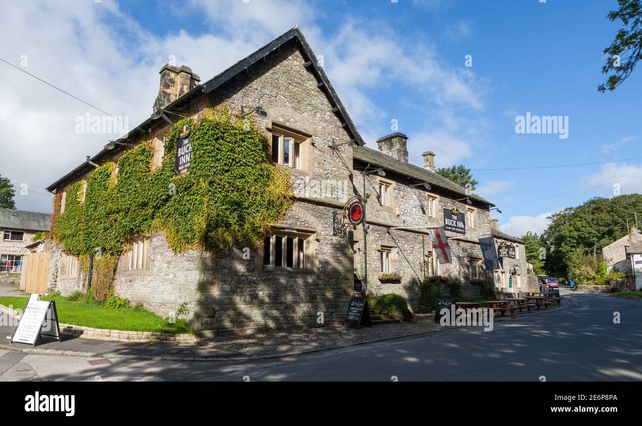 Sunny Summer view of the Buck Inn in the centre of the Yorkshire Dales village of Malham Stock Photo
