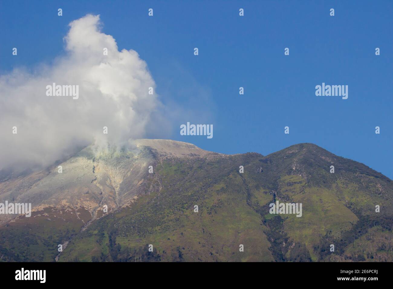 Sulfur smoke on the top of Mount Welirang, East Java, Indonesia. Mount Welirang is an active volcano with an altitude of 3156m above sea level Stock Photo