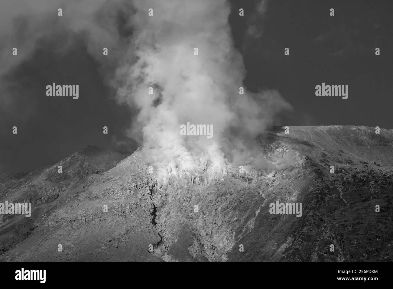 black and white of Sulfur smoke on the top of Mount Welirang, East Java, Indonesia. Mount Welirang is an active volcano with an altitude of 3156m abov Stock Photo