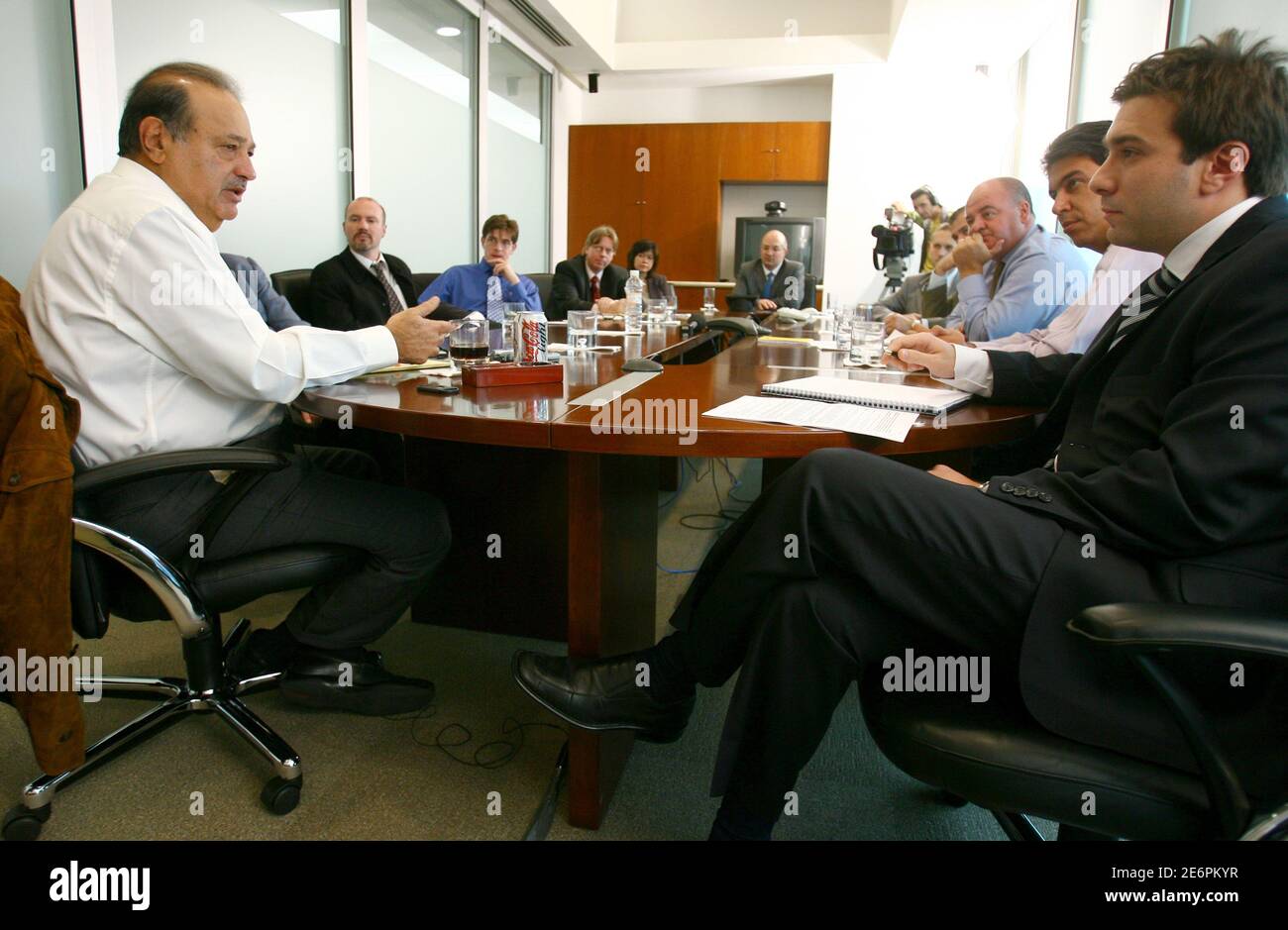 Mexican tycoon, Carlos Slim, the 3rd richest man in the world according to  Forbes, listens to a question during the Reuters Summit in Mexico City  March 24, 2006. REUTERS/Andrew Winning Stock Photo -