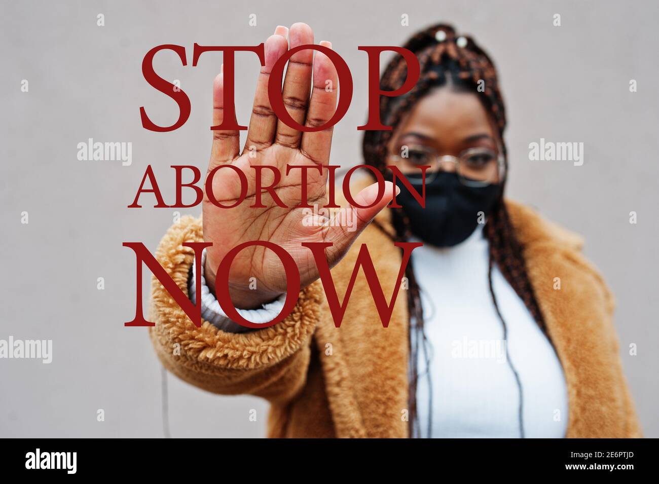 Stop abortion now. African american woman, wear black face mask show ...