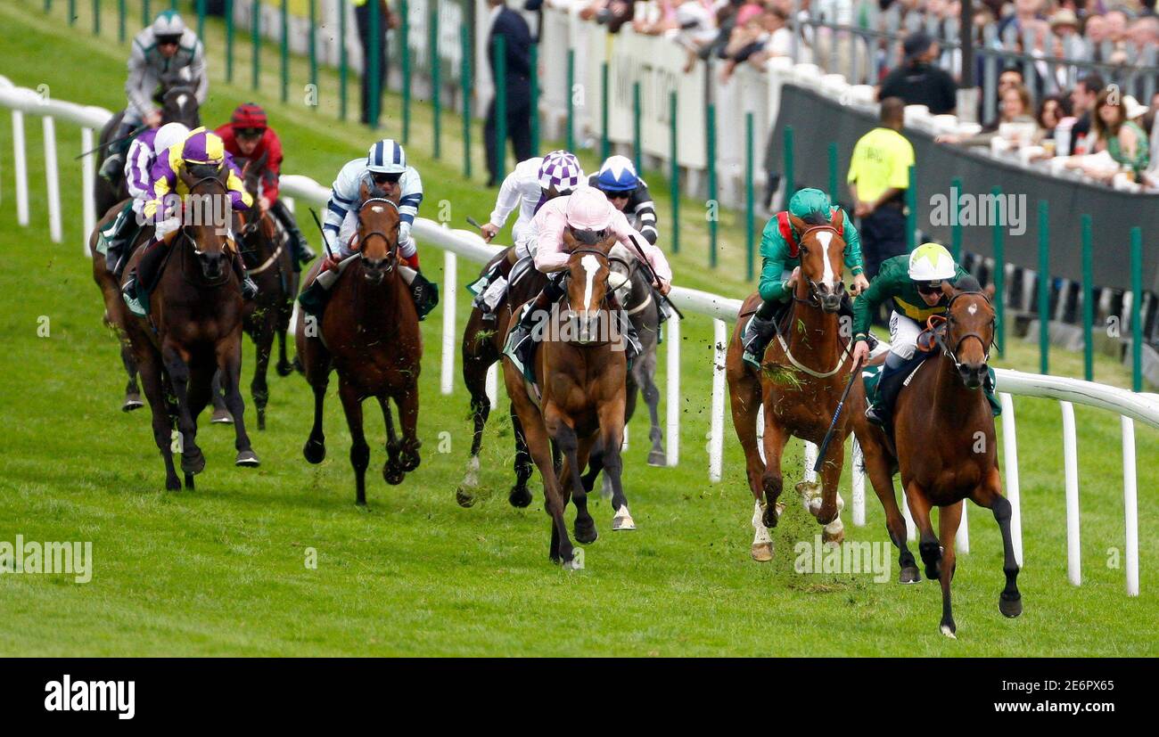 Seb Sanders riding Look Here (R) leads the pack to win the Oak during the Epsom Derby Festival at Epsom Downs in Surrey, southern England June 6, 2008. REUTERS/Alessia Pierdomenico (BRITAIN) Stock Photo