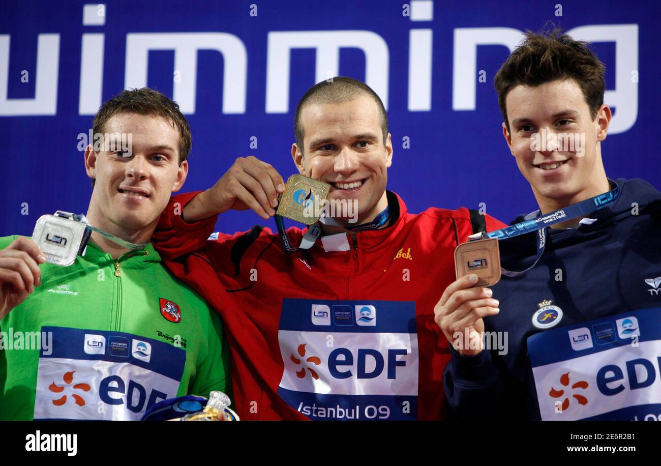 Vytautas Janusaitis of Lithuania (L-R), Markus Rogan of Austria and Alan Frons Cabello of Spain pose with their medals during the medal ceremony for the men's 200m individual medley at the European Short Course Swimming Championships in Istanbul December 10, 2009. REUTERS/Osman Orsal (TURKEY SPORT SWIMMING) Stock Photo