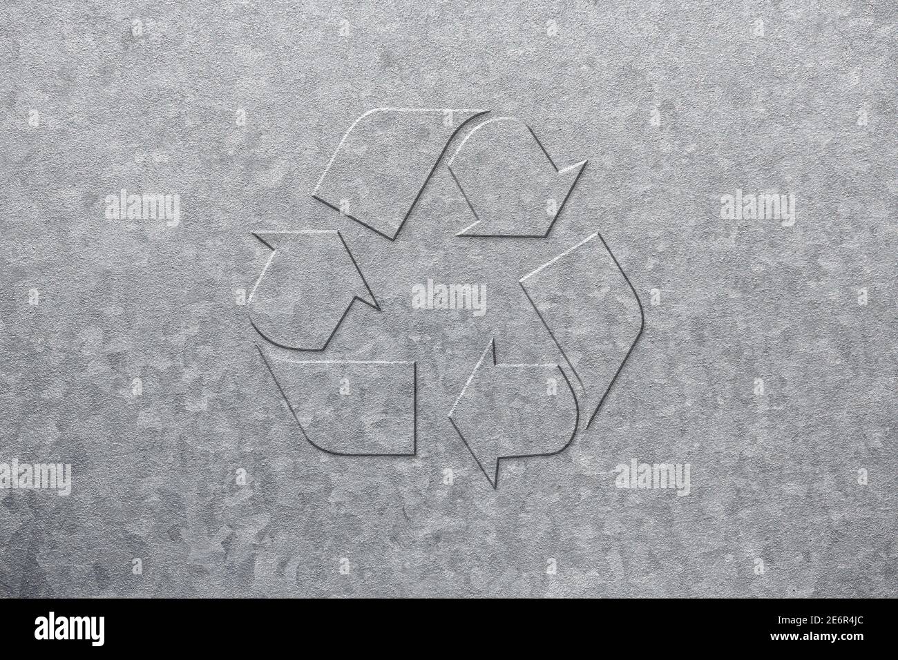 Universal logo of recyclable materials embossed on a galvanized steel plate. Stock Photo