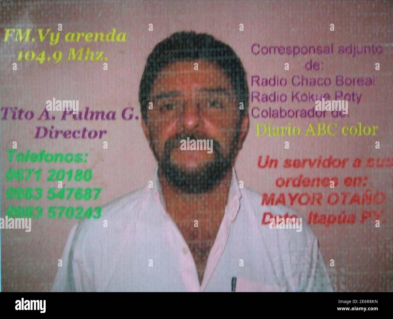 A publicity poster shows the face of Chilean journalist Tito Alberto Palma with a list of his telephone numbers and the media he worked for, in Mayor Otano where Palma lived 450 kms (280 miles) southeast of Asuncion, August 23, 2007. Palma was shot dead on August 22 as he sat at dinner with his family and the local police think his murder was in revenge for his reports against drug and gasoline smugglers along the border with Brazil. Picture taken August 23, 2007.  REUTERS/Ultima Hora  (PARAGUAY) Stock Photo