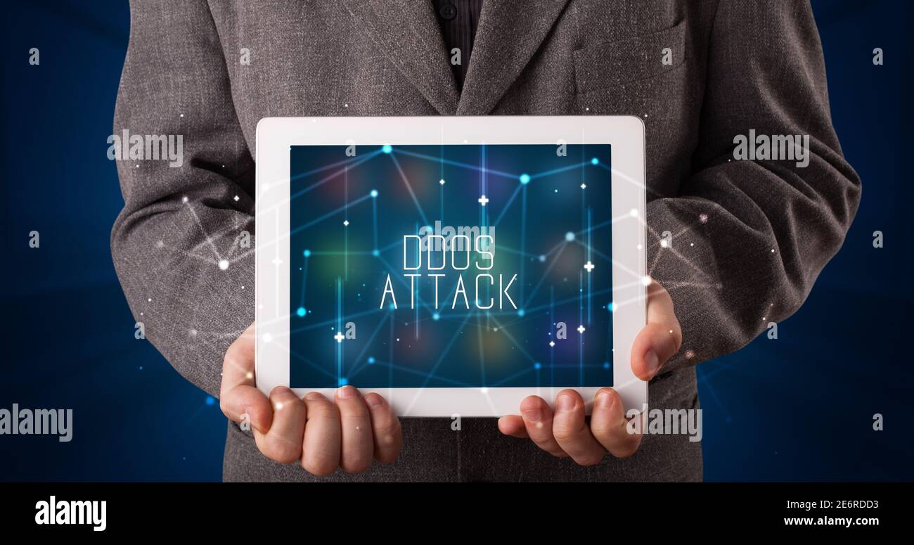 Young business person working on tablet and shows the digital sign ...