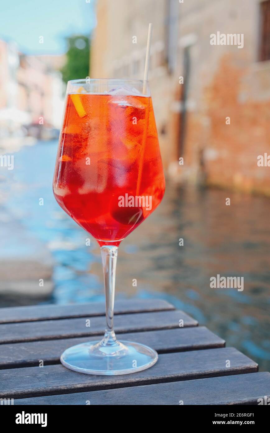 Glass of refreshing Aperol Spritz cocktail served on the deck bar in