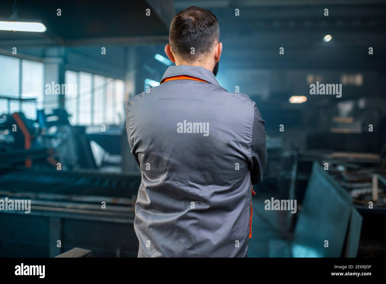 Metal industry worker at factory in work wear  Stock Photo