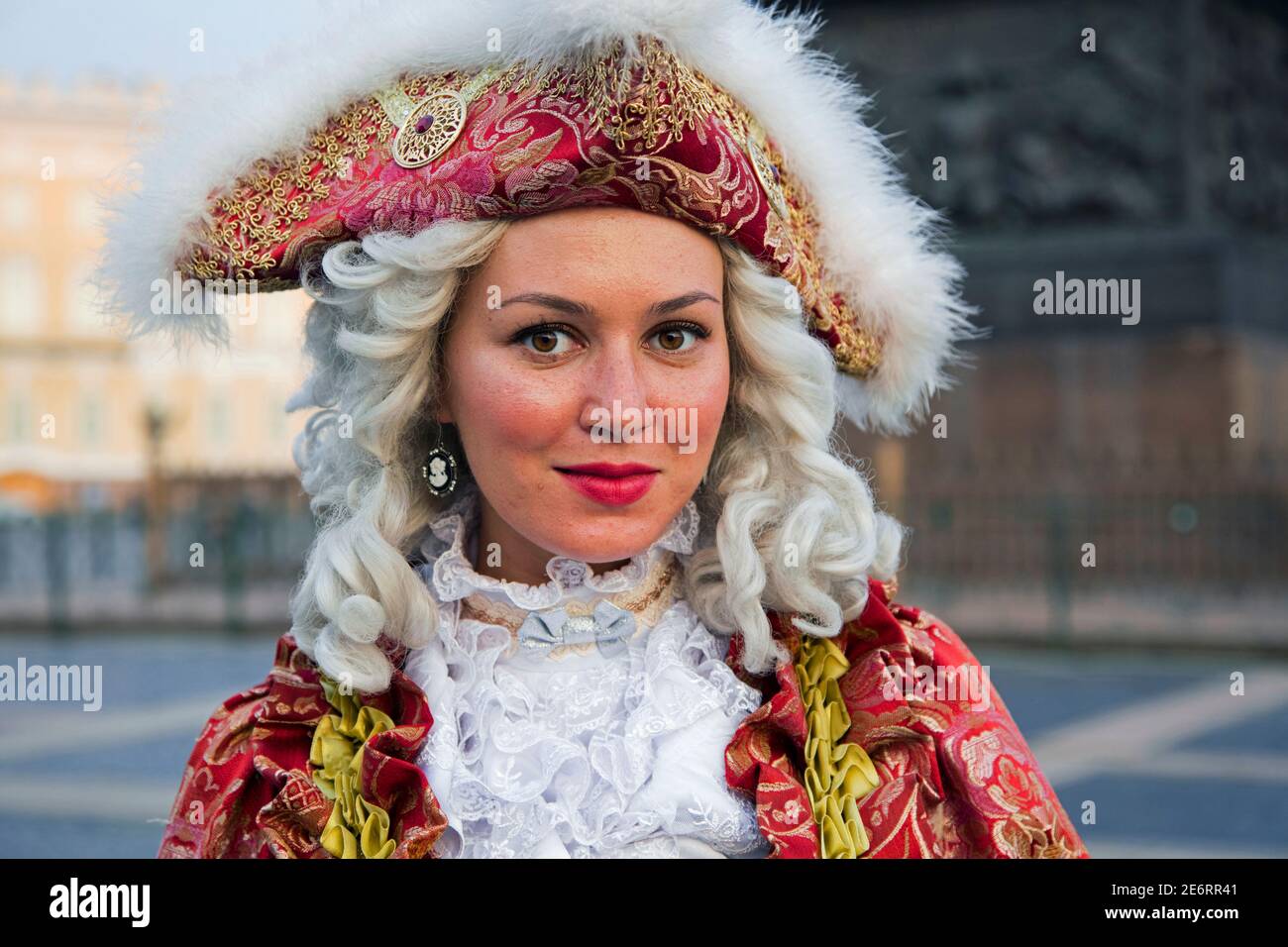 Russian woman in 18th century period dress posing for tourists by the