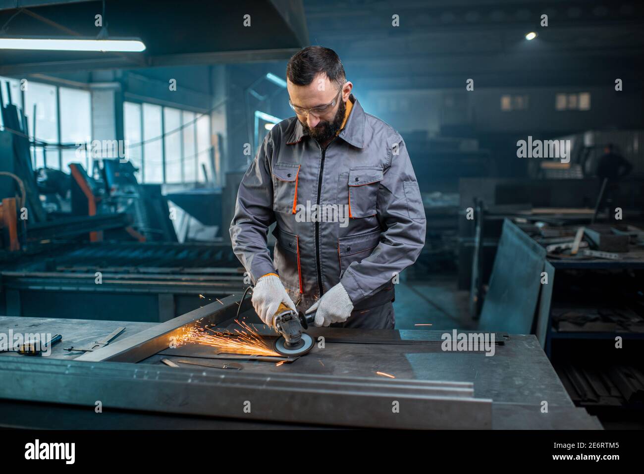 Metal industry worker at factory in work wear  Stock Photo