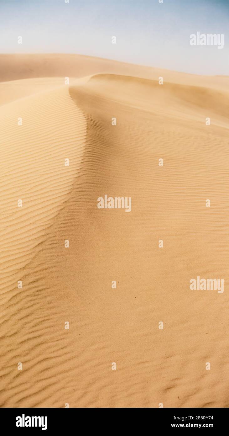 Vertical shot of sand dunes in a desert Stock Photo - Alamy