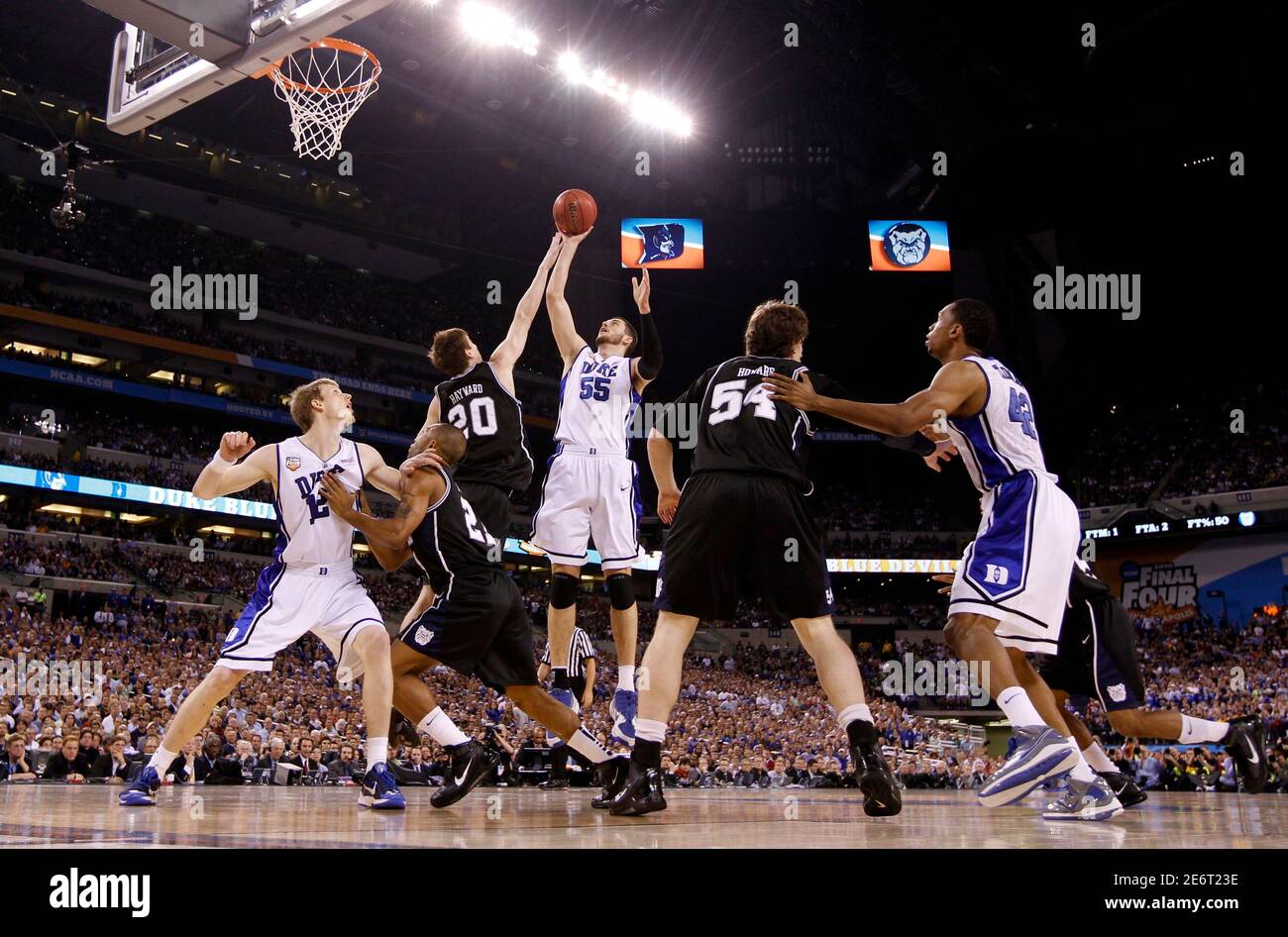 Duke's Brian Zoubek (55) shoots on Butler's Gordon Hayward (20) during their NCAA National Championship college basketball game in Indianapolis, Indiana, April 5, 2010.     REUTERS/Jeff Haynes (UNITED STATES - Tags: SPORT BASKETBALL) Stock Photo