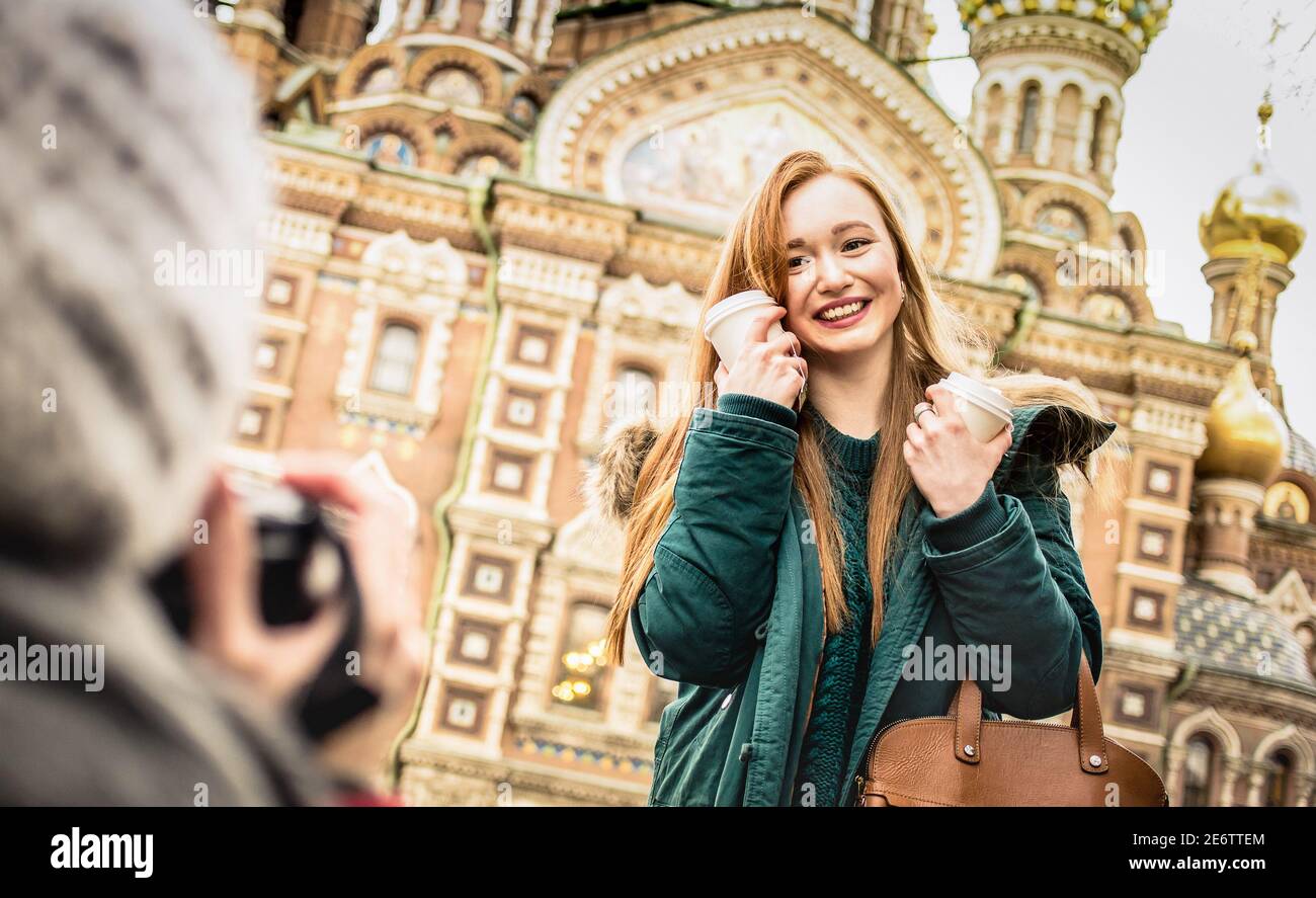Happy girlfriends taking winter travel photo at ' Savior on Spilled Blood ' church in Saint Petersburg - Friendship wanderlust concept Stock Photo