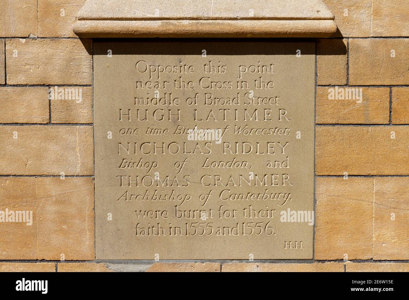 Plaque on the wall of Balliol College, Broad Street commemorating three members of the clergy burnt for their faith (1555/56), Oxford, Oxfordshire, UK Stock Photo