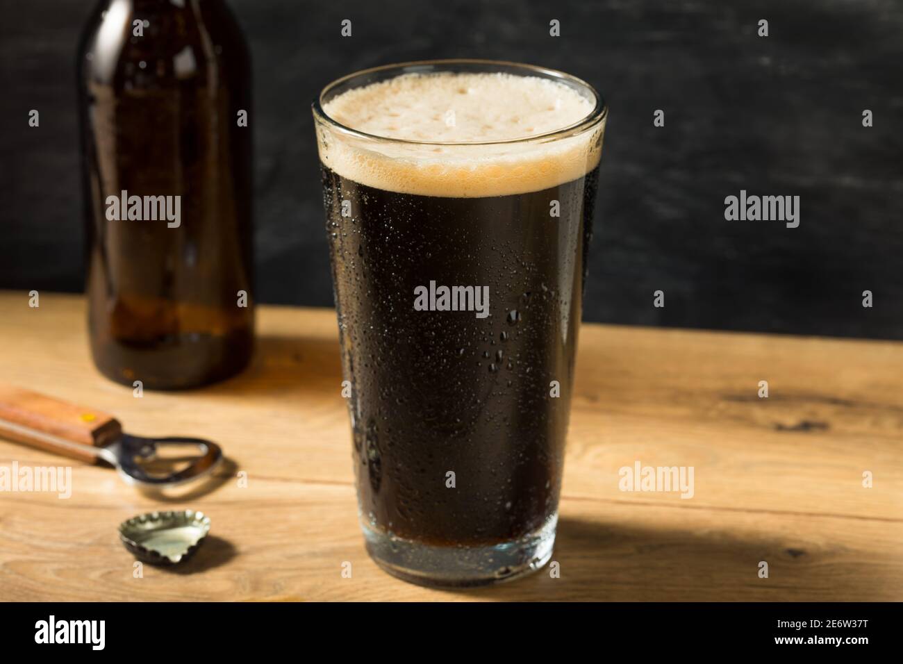 Refreshing Boozy Dark Stout Beer in a Pint Glass Stock Photo