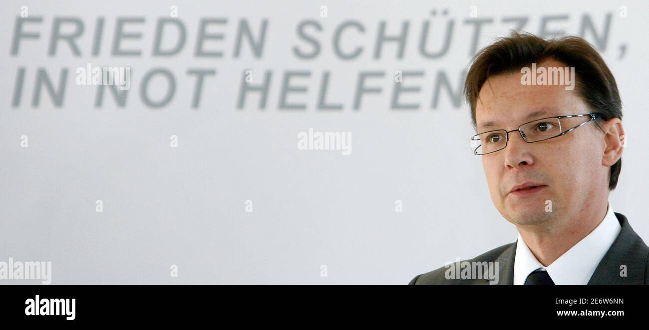 Minister for National Defence Norbert Darabos listens during a conference in Vienna November 27, 2007. 'Frieden schuetzen, in Not helfen' reads 'Preserve peace, help in need'.  REUTERS/Herbert Neubauer  (AUSTRIA) Stock Photo