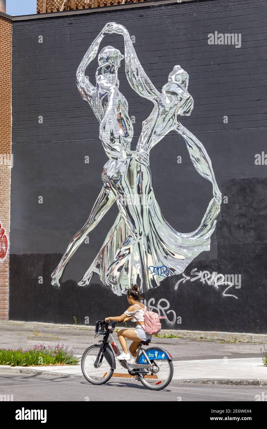 Canada, province of Quebec, Montreal, the Plateau-Mont-Royal district, street art, mural The Chrome Dance by the artist Bik Ismo, young cyclist in BIXI Stock Photo