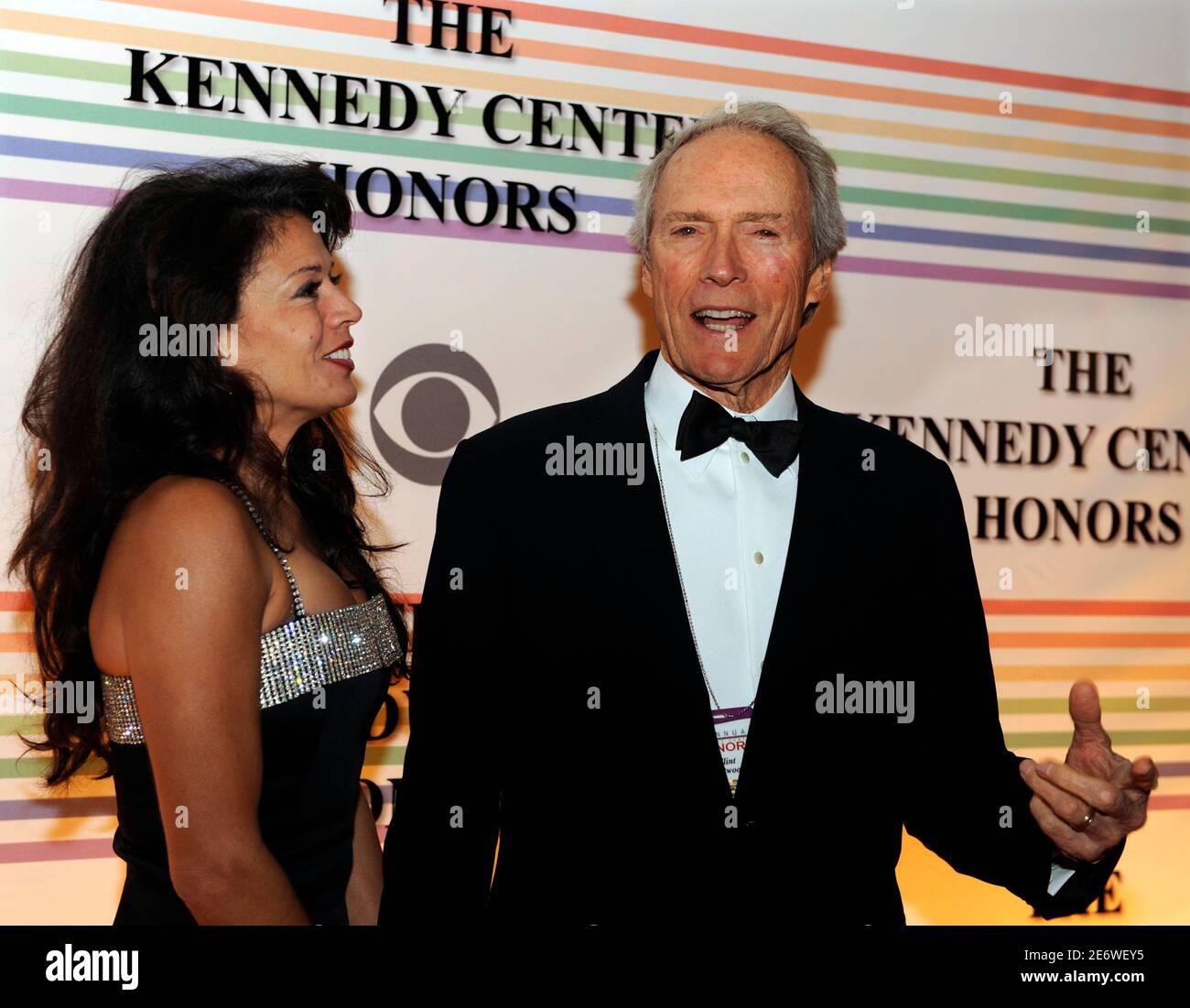 Former Kennedy Center Honoree actor and director Clint Eastwood holds hands with his wife Dina Ruiz as they arrive at the Kennedy Center for the Gala in Washington December 7, 2008. The 31st Annual Kennedy Center Honors awards are given for lifetime achievement in the performing arts.  REUTERS/Mike Theiler (UNITED STATES) Stock Photo