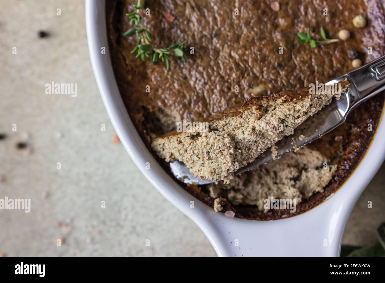 Baked chicken or turkey liver pate or souffle in ceramic mold with