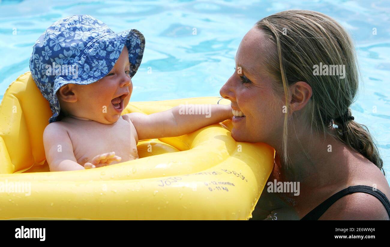 Bibi Thomson R And Her Son Kitt Enjoy A Swim At The Guildford Lido In Southern England July 19 06 Temperatures In Britain Are Expected To Hit All Time Record Highs For July