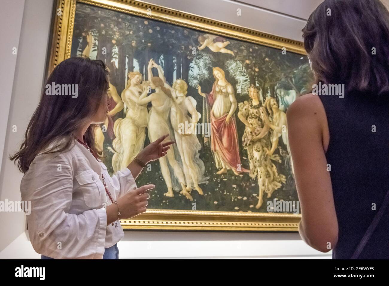 Italy, Tuscany, Florence, historic center listed as World Heritage by UNESCO, museum in Galleria degli Uffizi (Uffizi Gallery), visit with tourist guide Alice Le Bot in front of Sandro Botticelli, Spring (la Primavera) painted in 1478 Stock Photo