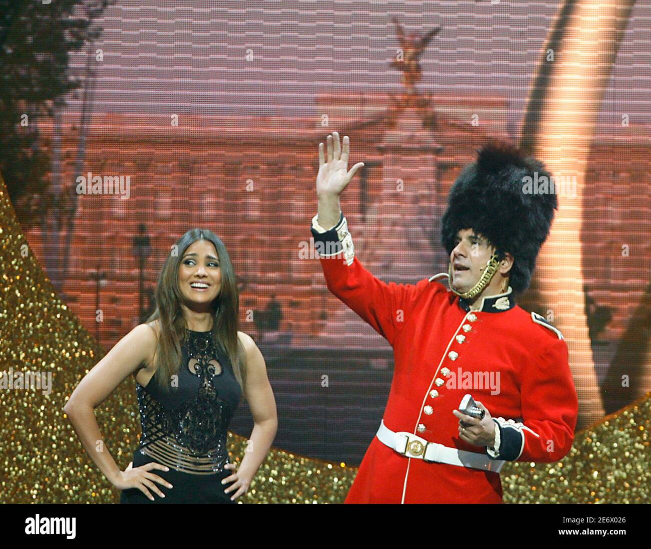 Bollywood actors Boman Irani and Lara Dutta perform on stage during the