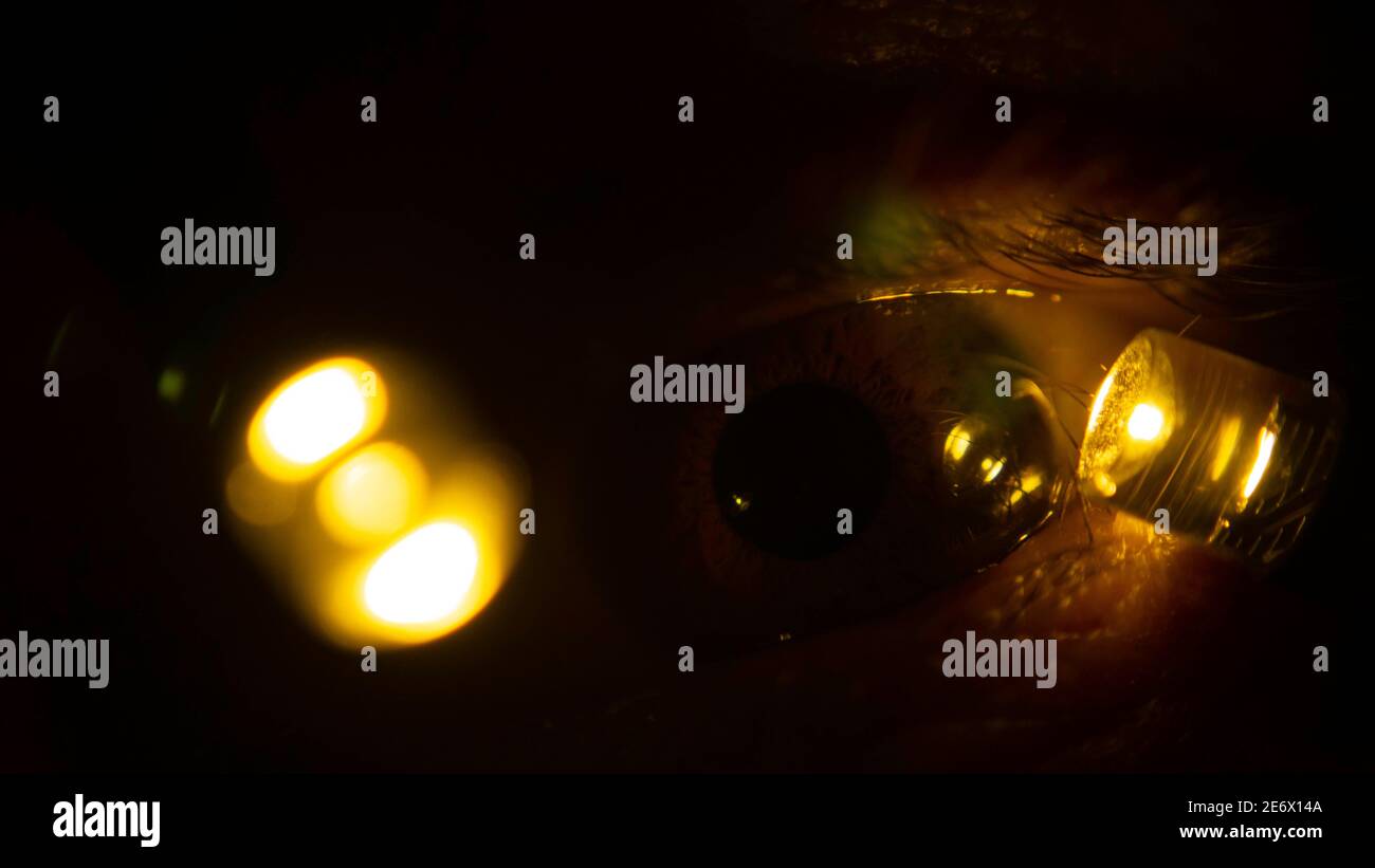 Illuminated human eye in the dark Stock Photo Alamy