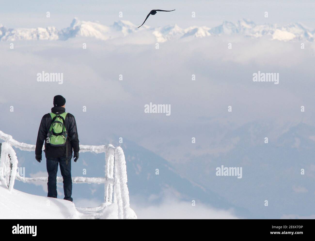 A man enjoys a walk on top of the Mount Saentis (2502 meter/8209 feet above  sea level) near Schwaegalp in the eastern Swiss Alps October 15, 2009. A  large part of Switzerland