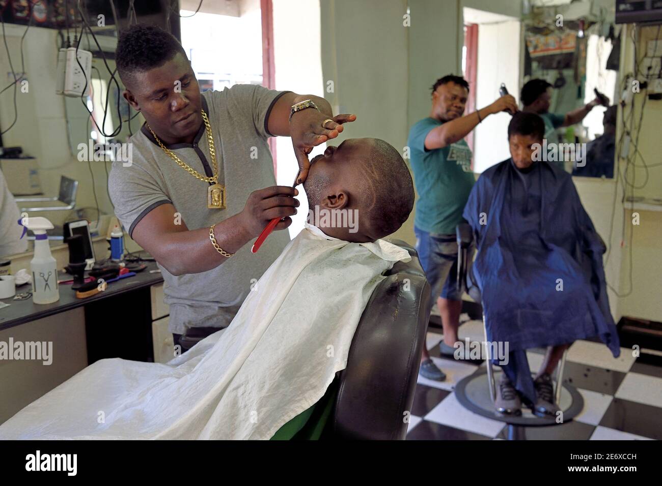 Caribbean, Dominica Island, the capital city Roseau, French Quarter, men's hair  salon on the main street Great George Street Stock Photo - Alamy