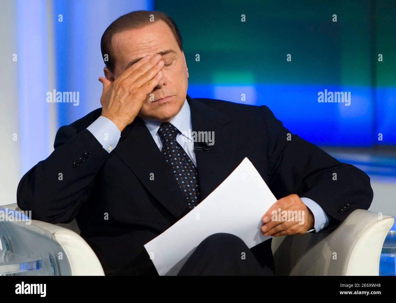 Italy's Prime Minister Silvio Berlusconi attends the taping of the  television program Porta a Porta ("Door to door" in Italian) in Rome May 5,  2009. His wife Veronica said over the weekend