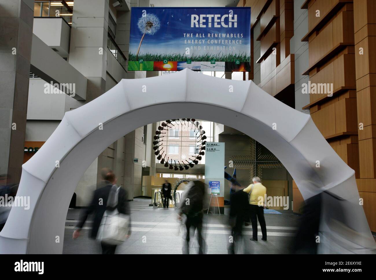 Participants at the 2010 Renewable Energy Technology Conference and Exhibition (RETECH 2010) walk at the entrance to the Exhibit Hall in Washington, February 4, 2010. REUTERS/Hyungwon Kang    (UNITED STATES - Tags: ENERGY BUSINESS SCI TECH) Stock Photo
