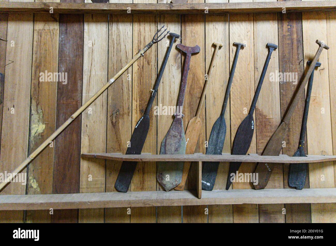 various hand carved wooded oars or paddles Stock Photo