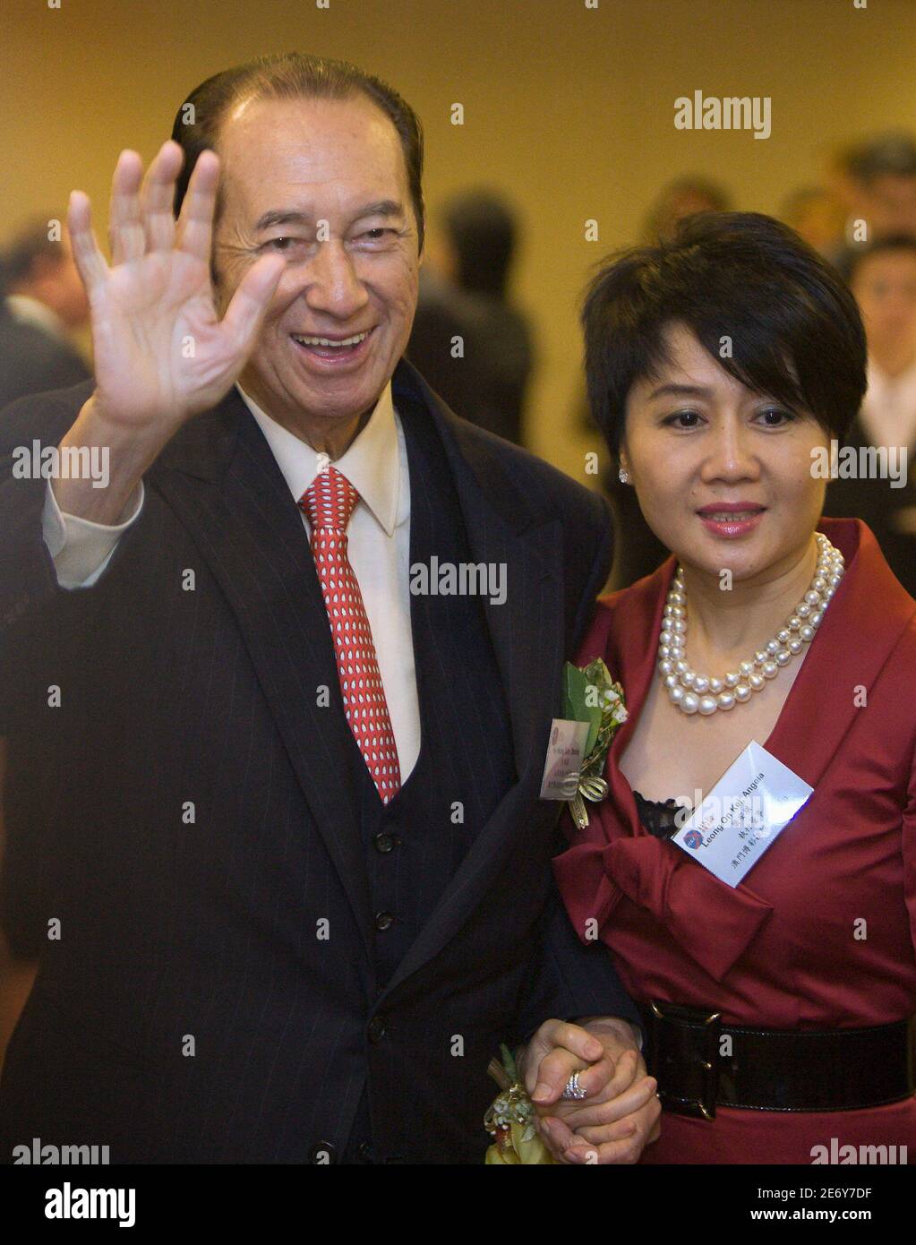 Macau Tycoon Stanley Ho L And His Wife Angela Leong On Kei Arrive To The Listing Ceremony Of Sjm Sociedade De Jogos De Macau Holdings Ltd At The Hong Kong Stock Exchange