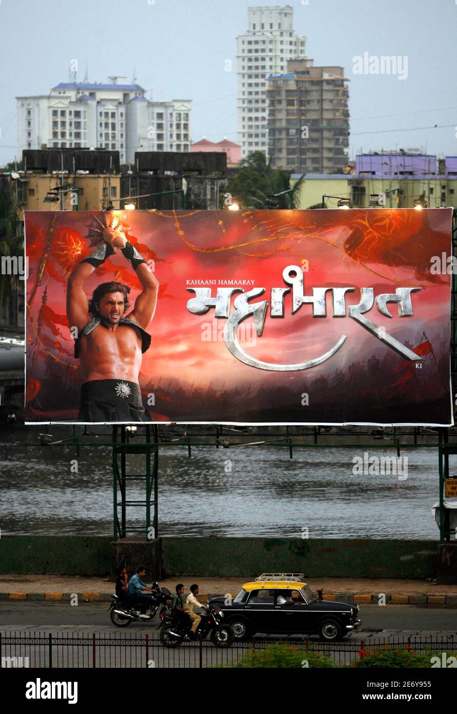 A billboard advertising the 'Mahabharata' television serial is put up on a street of Mumbai July 11, 2008. The 'Ramayana' and 'Mahabharata', two of India's best loved epics about gods, demons and cataclysmic wars are making a comeback on Indian television, hoping to recreate with snazzy visual effects the magic they wove on TV two decades ago. REUTERS/Punit Paranjpe (INDIA) Stock Photo