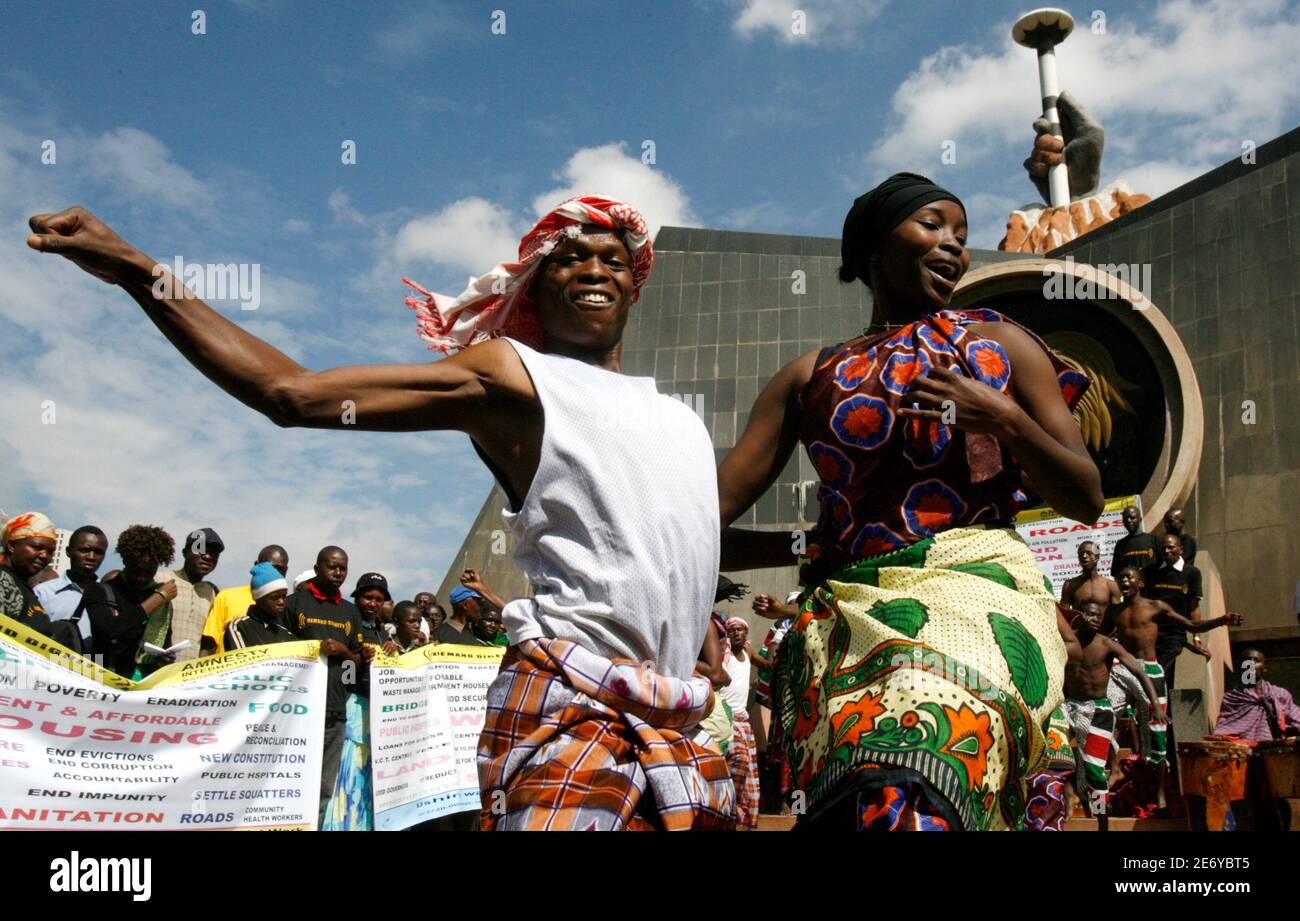 Kenyan activists perform before a demonstration in Nairobi June 11, 2009. Amnesty International Secretary-General Irene Khan on Thursday joined people from settlements in Nairobi to voice their demand for the right to adequate housing. REUTERS/Thomas Mukoya (KENYA SOCIETY) Stock Photo