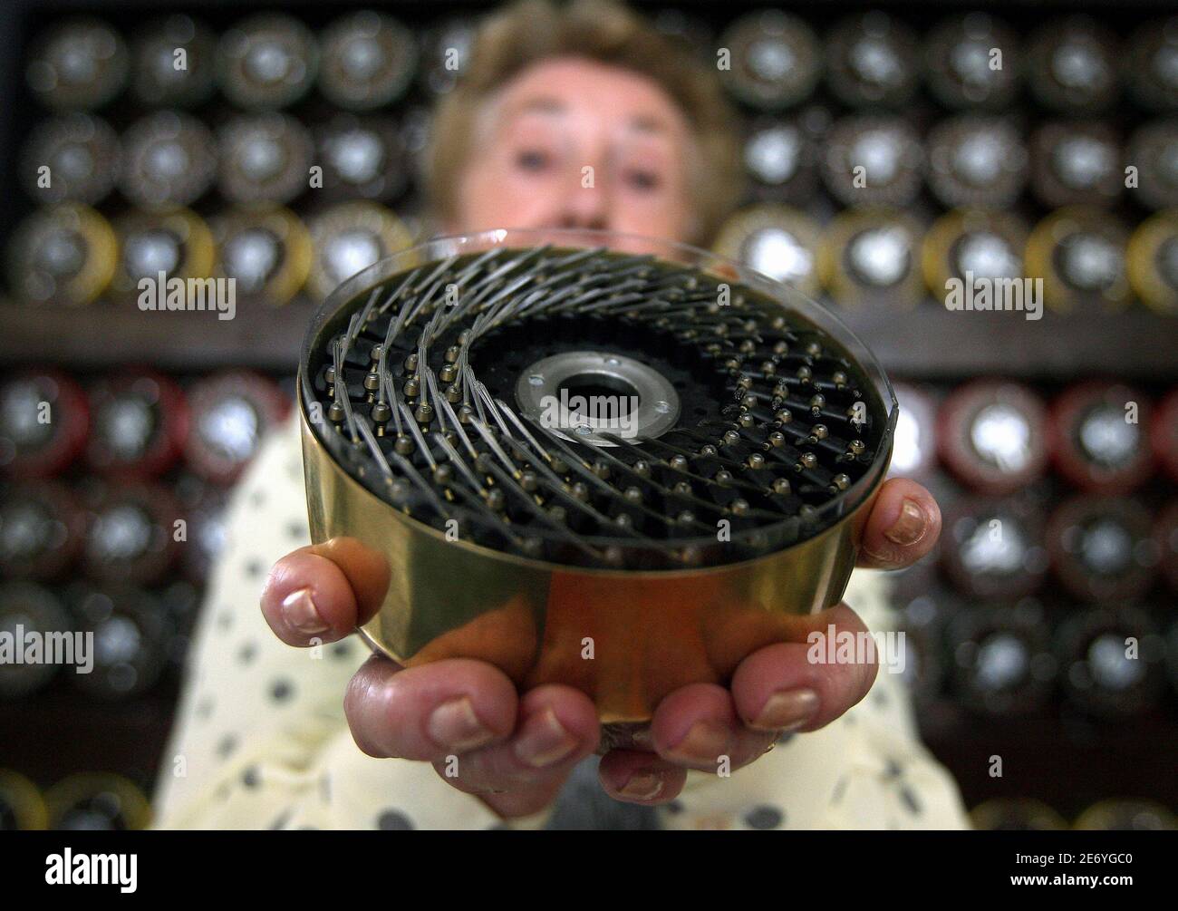 Former Bombe operator Jean Valentine shows a drum of British Turing Bombe machine in Bletchley Park Museum in Bletchley, central England, September 6, 2006. For the first time in sixty years Bletchley Park re-created the way the 'unbreakable' Enigma code was broken using functioning World War Two equipment. The Bombe was the brainchild of mathematical genius' Alan Turing and Gordon Welchman, and enabled Bletchley Park's Cryptographers to decode over 3000 enemy messages a day breaking the codes created by German military Enigma machine during World War Two.   REUTERS/Alessia Pierdomenico (BRITA Stock Photo
