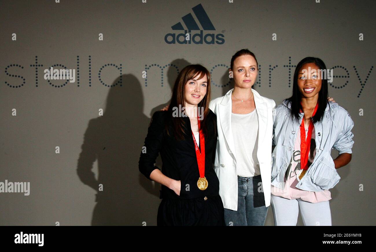 Olympians Victoria Pendleton from Britain (L) and Allyson Felix (R) from  the U.S. pose with Stella McCartney after her Adidas by Stella McCartney  spring/summer 2009 show at London Fashion Week September 16,