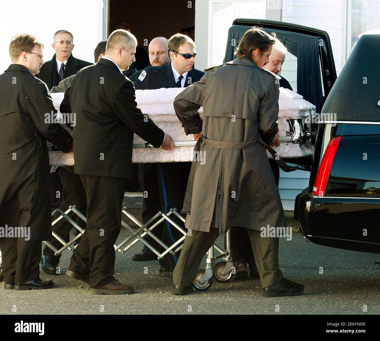 The coffin containing the remains of 12 year-old Karissa Boudreau is carried to a hearse at a funeral home in Barrington, Nova Scotia, February 19, 2008. The grade 6 student's body was discovered February 9 along the banks of the LaHave river near the town of Bridgewater. Royal Canadian Mounted Police are calling her death a homicide.     REUTERS/Paul Darrow  (CANADA) Stock Photo