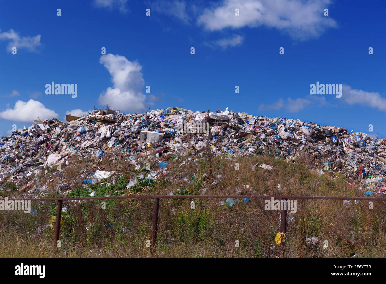 Storage of waste in the open air. Dump of unsorted waste. Ecological problems. Contamination of the environment. Stock Photo