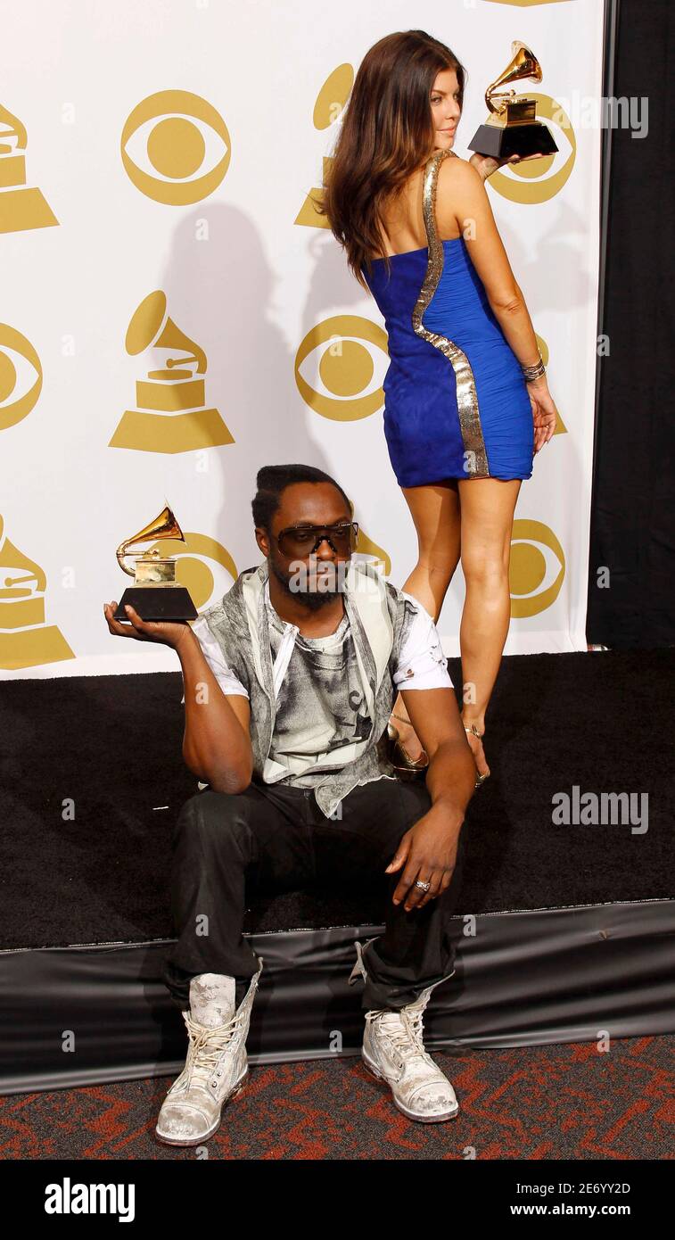 Black Eyed Peas will.i.am (L) and Fergie pose with their Grammy awards
