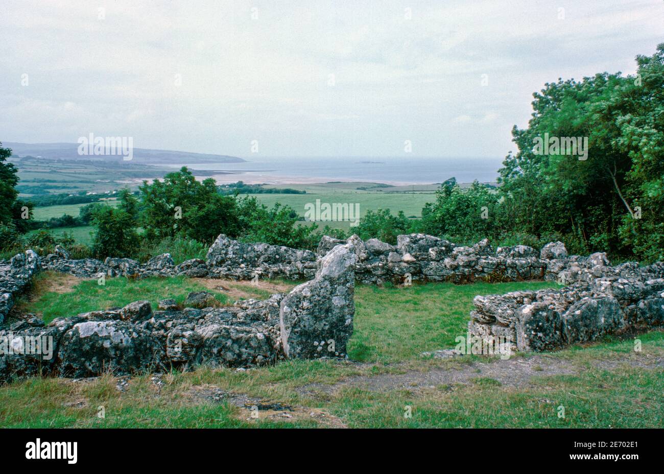 Ruins of Din Lligwy Roman village near Moelfre, North Wales. Fortified rectangular residence hut. Archival scan from a slide. July 1977. Stock Photo