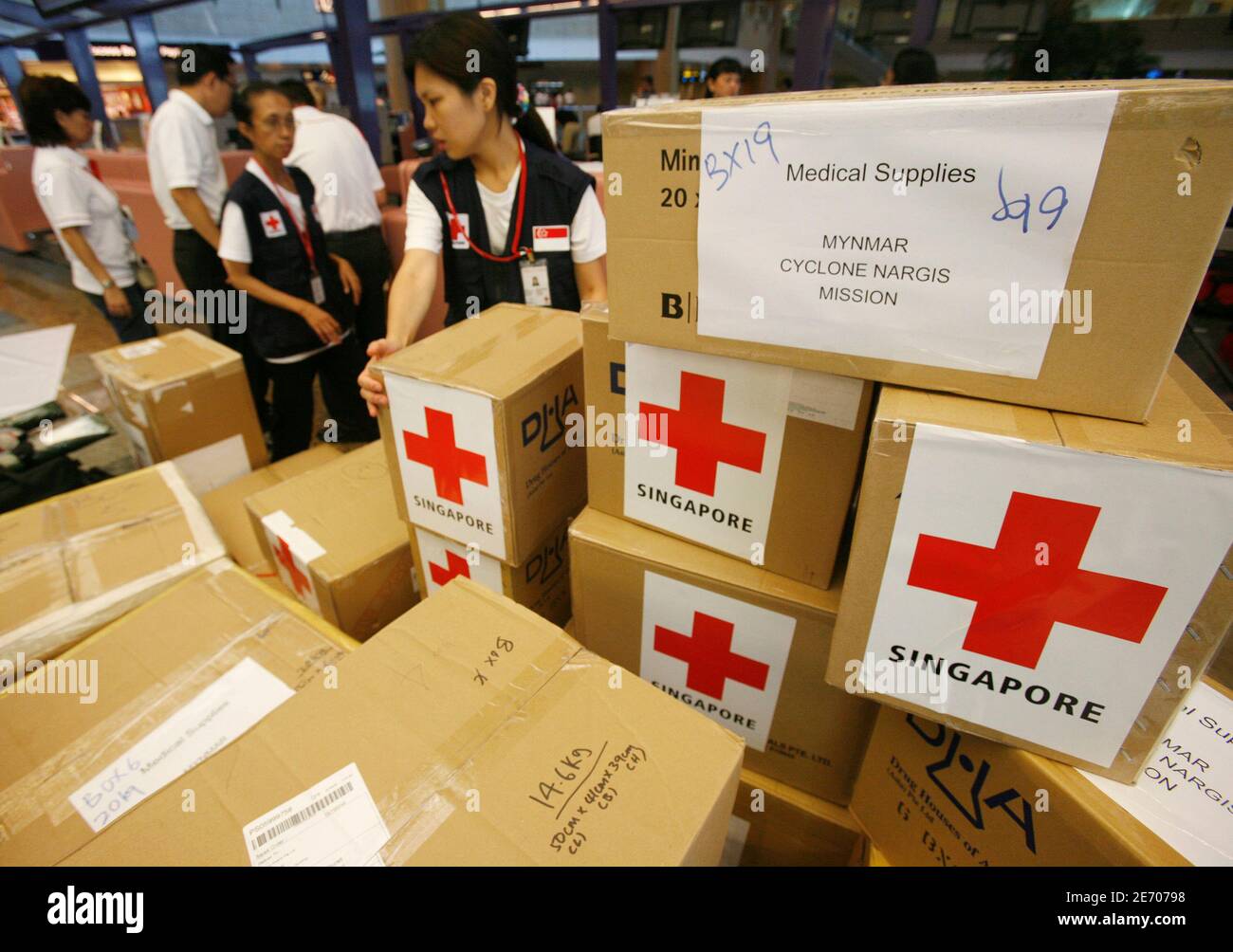 Members of the Singapore Red Cross prepare to leave for Myanmar with  S$20,000 ($14,710) worth of medical aid at Singapore's Changi Airport May  23, 2008. The team is the first group of