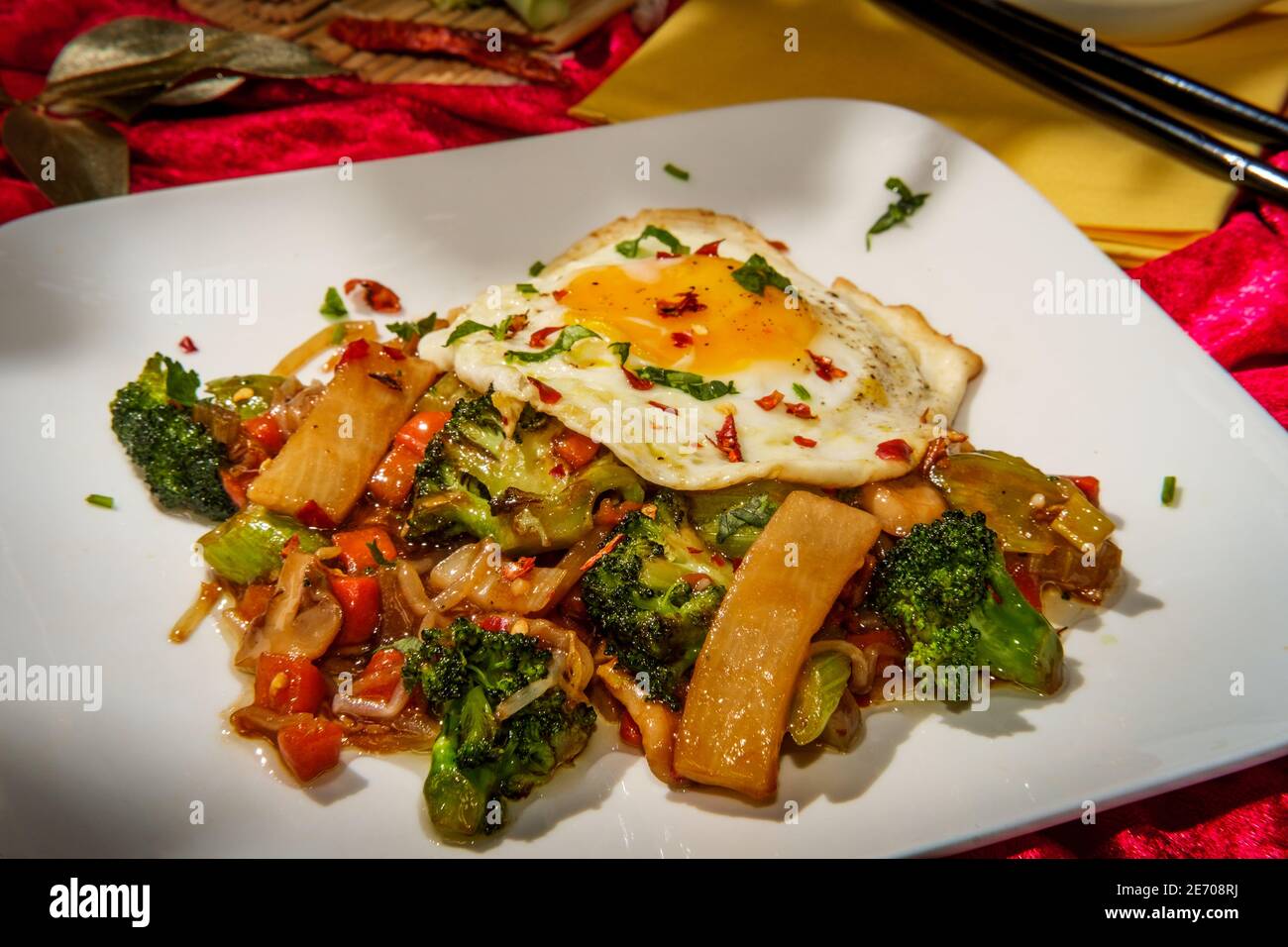 Canned Chinese food chop suey with fried sunny side up egg Stock Photo