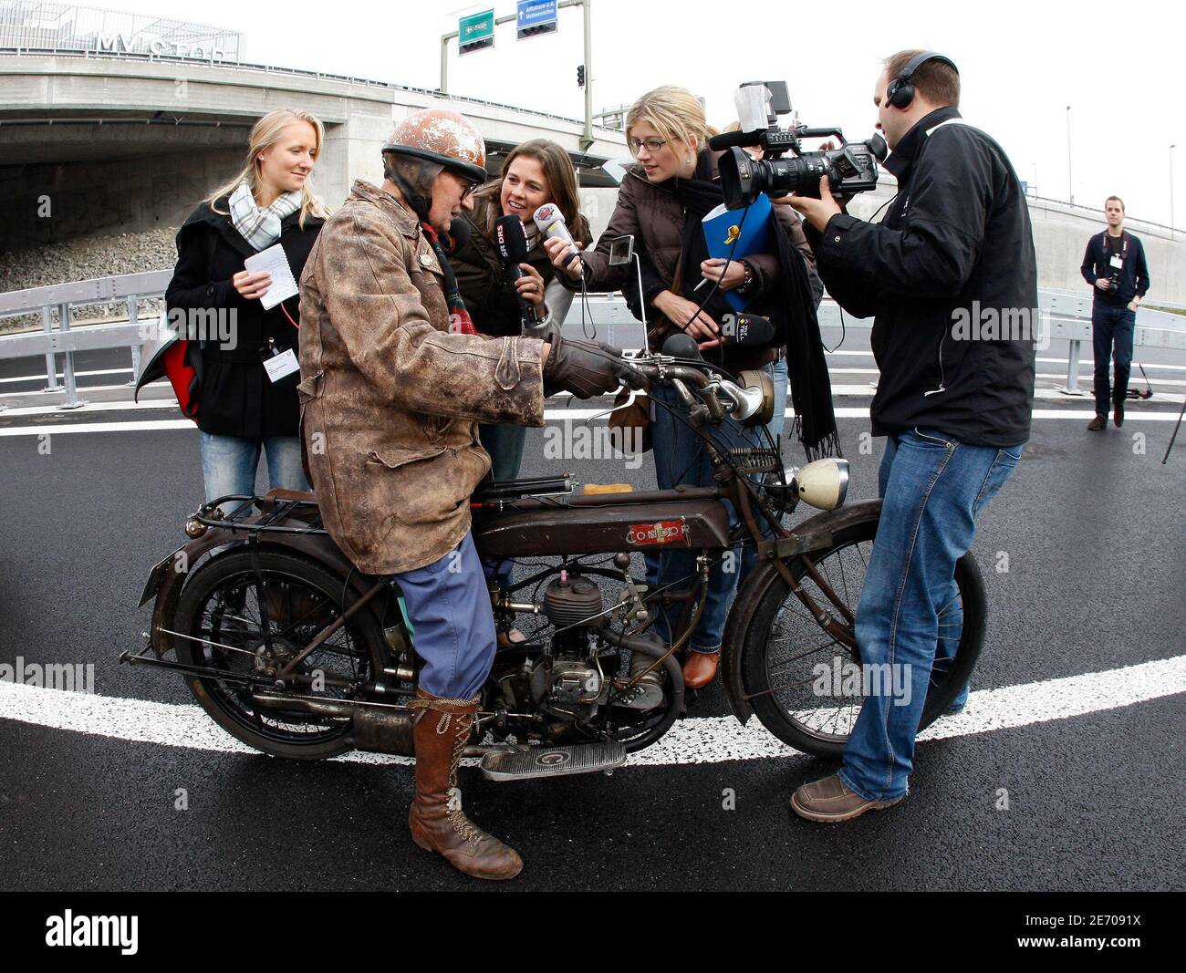 Motorcyclist, 91 year-old Ernst Baltisberger from Switzerland, answers  reporters questions before driving his partly self made motorbike on the  new A4 " Knonaueramt " motorway near Affoltern am Albis November 13, 2009.