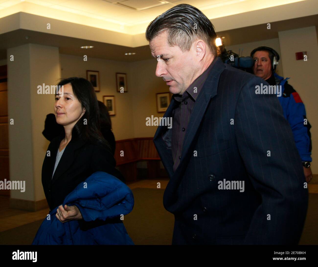 Richard (R) and Mayumi Heene arrive at  Larimer County district court for their sentencing hearing in Fort Collins, Colorado December 23, 2009. The parents of a Colorado boy thought to have floated away in a homemade helium balloon are being sentenced on criminal charges of staging the incident in a publicity-seeking hoax. REUTERS/Rick Wilking (UNITED STATES - Tags: SOCIETY) Stock Photo