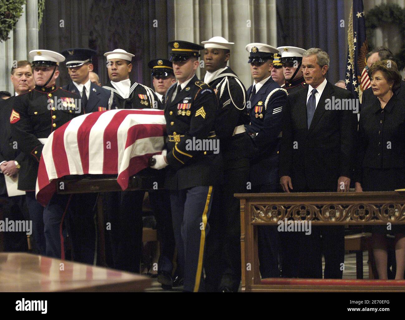 The casket of former U.S. President Gerald Ford is carried past U.S. President George W. Bush and first lady Laura Bush during Ford's state funeral at the National Cathedral in Washington D.C., USA on January 2, 2007. Photo by DOD via ABACAPRESS.COM Stock Photo