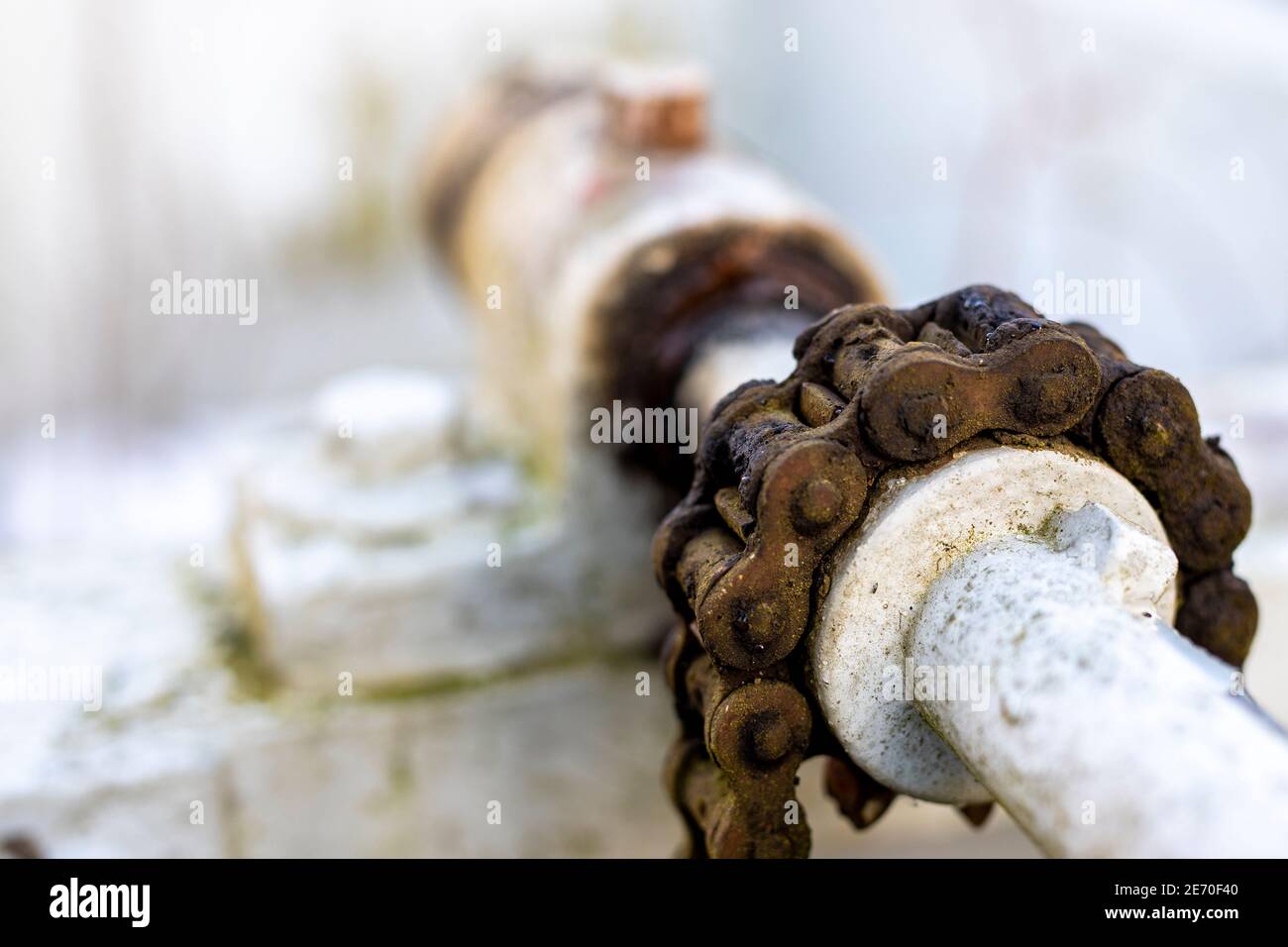 Small chain gear. Steel structure in the dam. Light background. Stock Photo