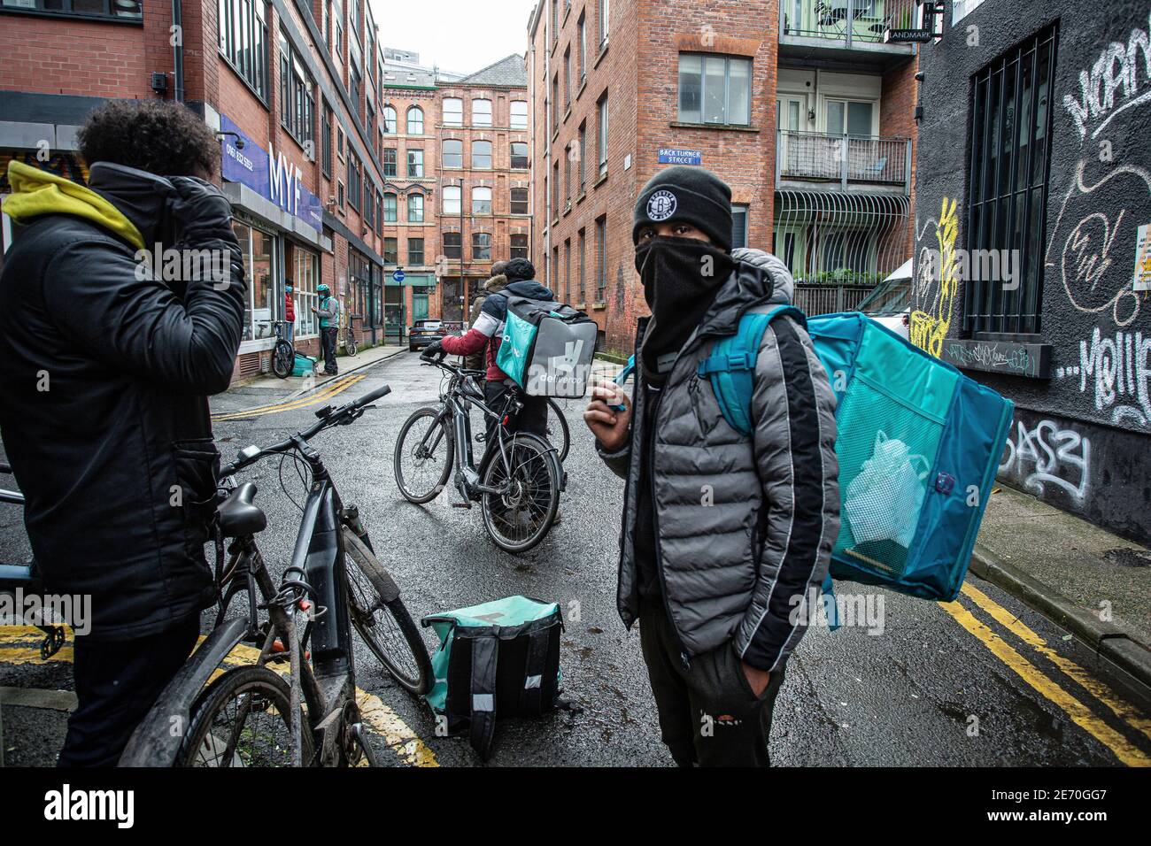 Deliveroo workers / riders in Manchester, first generation immigrants, predominantly coming from the Middle East and Eritrea. Stock Photo