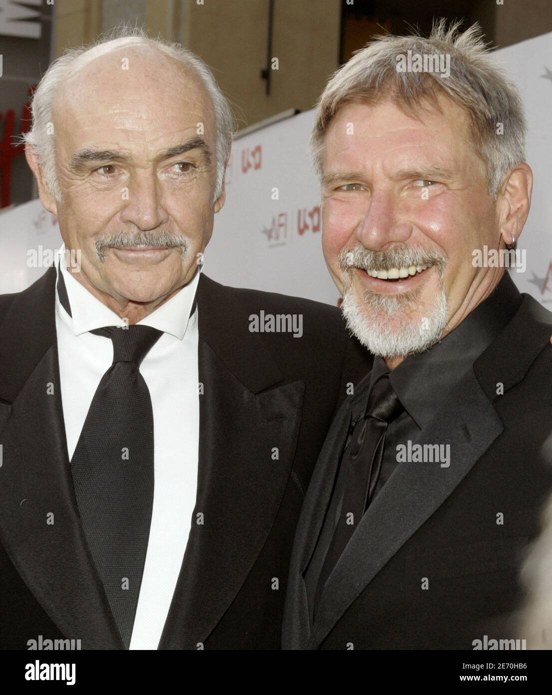 Actors Harrison Ford and Sean Connery (L) pose as they arrive at the American Film Institute's 'AFI Life Achievement Award, A Tribute to Sir Sean Connery' taping in Hollywood June 8, 2006. [The show that honored Connery's long career will be telecast on the USA Network cable channel on June 21.] Stock Photo