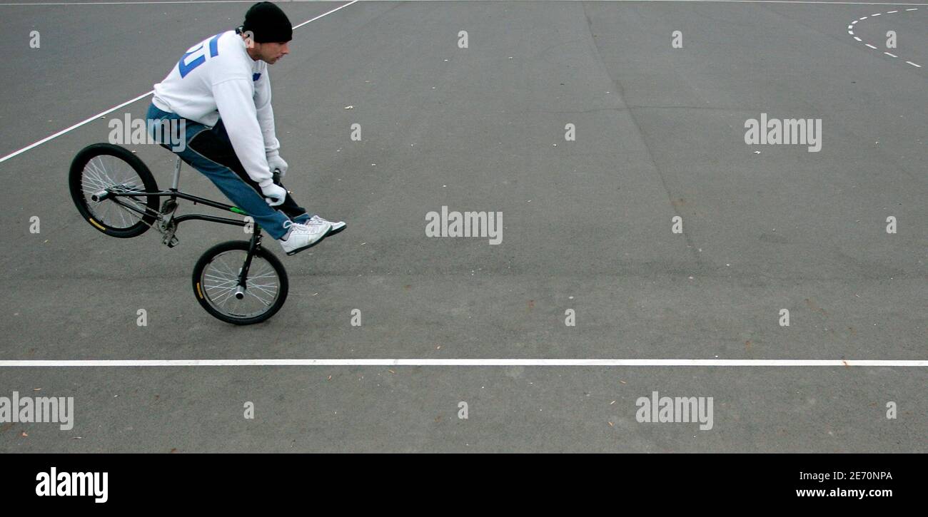 A BMX rider practices at the sports grounds of an estate of prefabricated  concrete buildings in Miskolc November 6, 2007. In the space of a few  "five-year plans" around the 1960s and